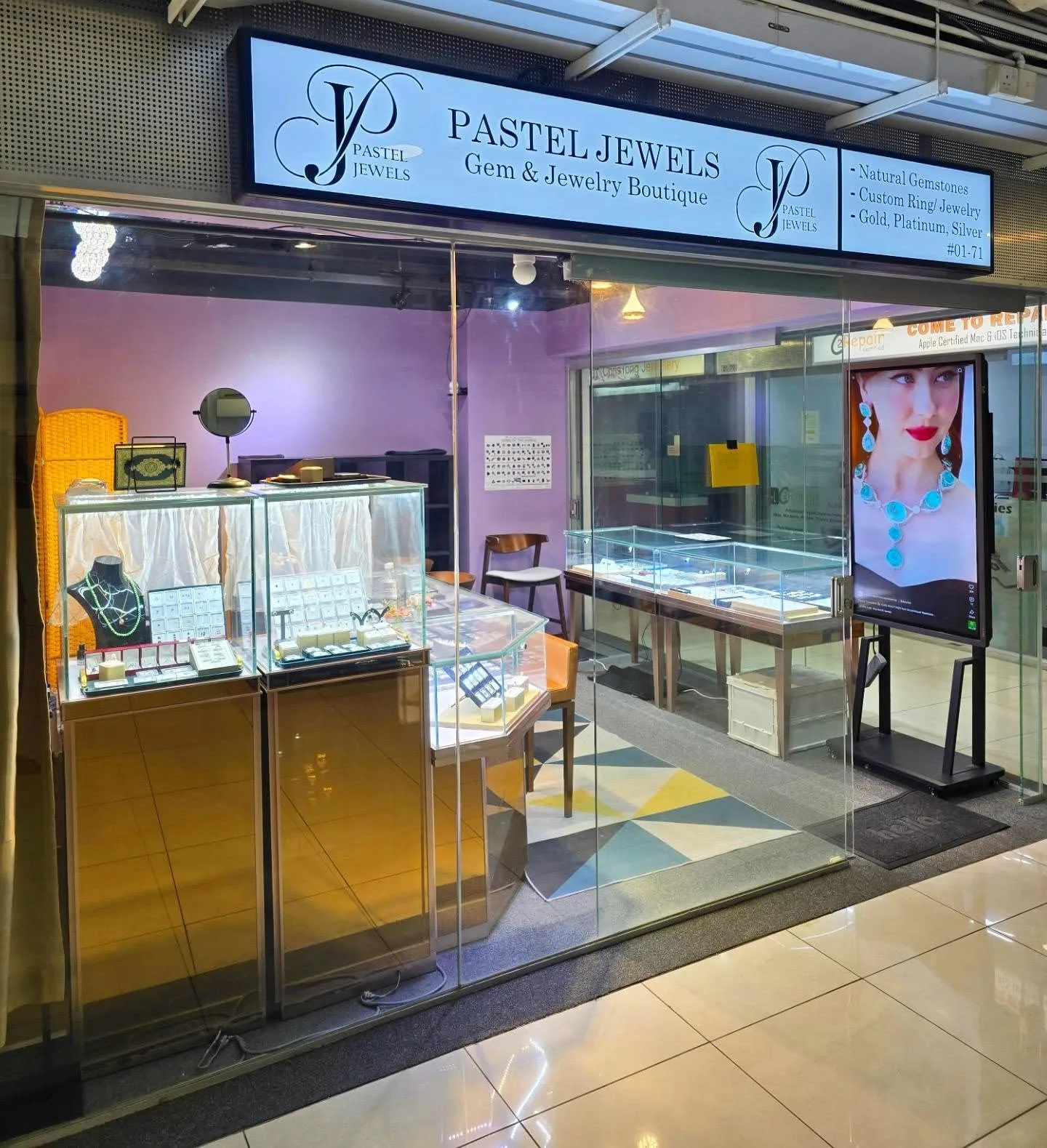 The Pastel Jewels shop front at Far East Plaza, with the lit shop sign and glass display cases